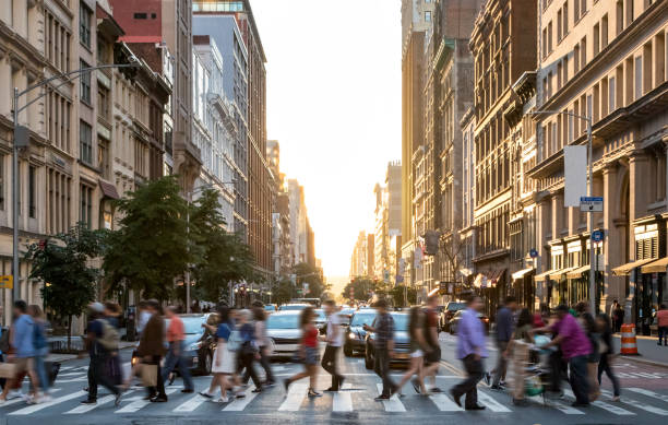 istockphoto-1392135352-612x612 Diverse crowd of people walking across the busy intersection of 23rd Street and 5th Avenue in Manhattan New York City NYC