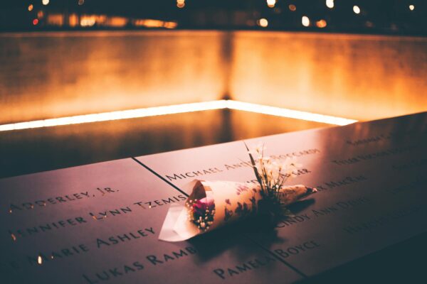 pexels-photo-5691277-5691277 Close-up of Flowers Lying on the 9/11 Memorial in New York City, New York, United States